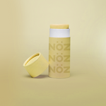 Load image into Gallery viewer, Nöz’s natural zinc and vegan sunscreen stick in neon yellow, with its cap off.
